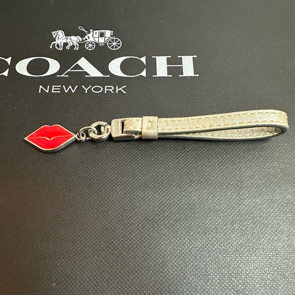 Coach hang tag Lip Charm in Vibrant Red